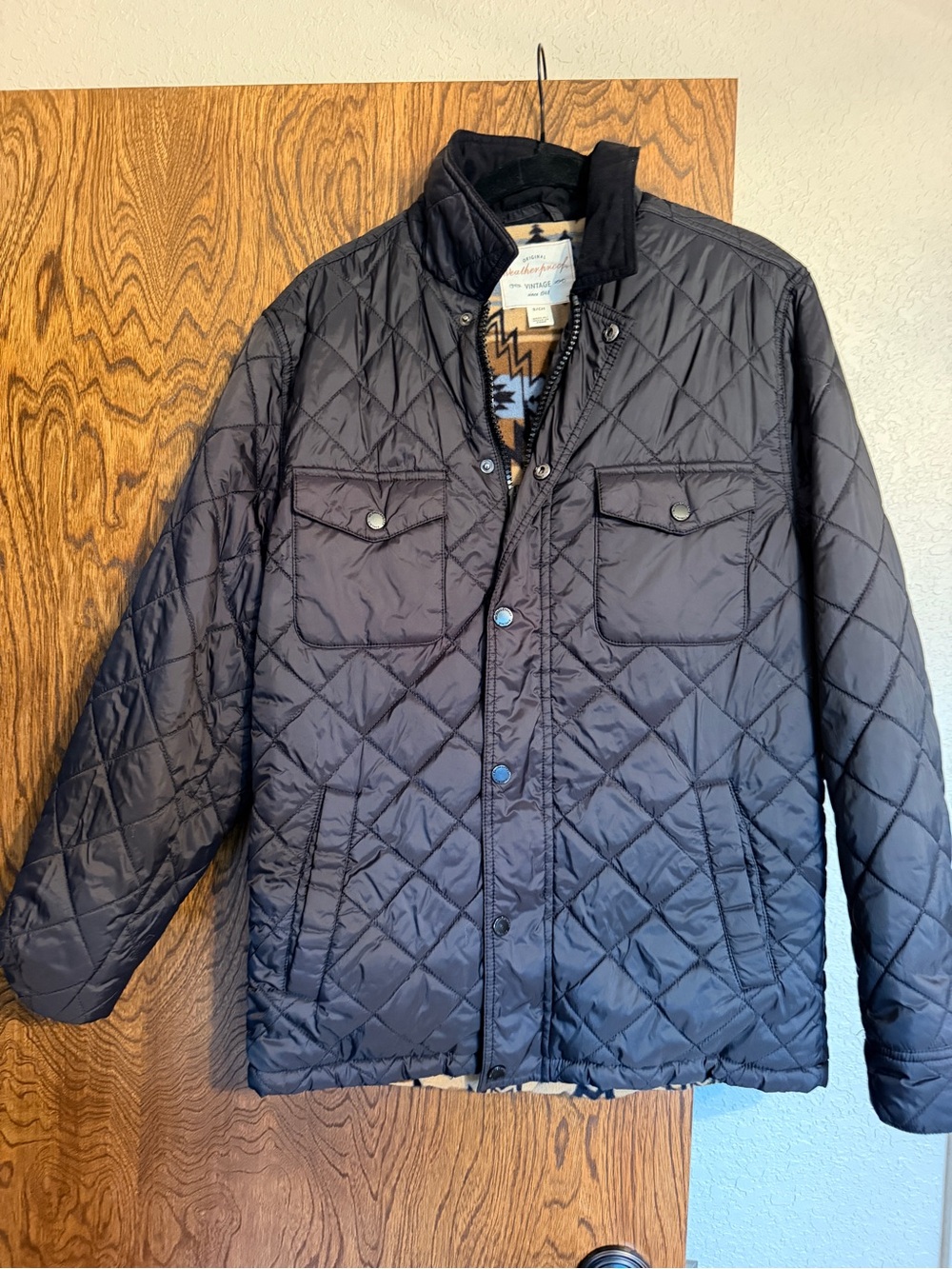 Weatherproof (or womens) Men’s Black Puffer Jacket with Patterned Tan Liner